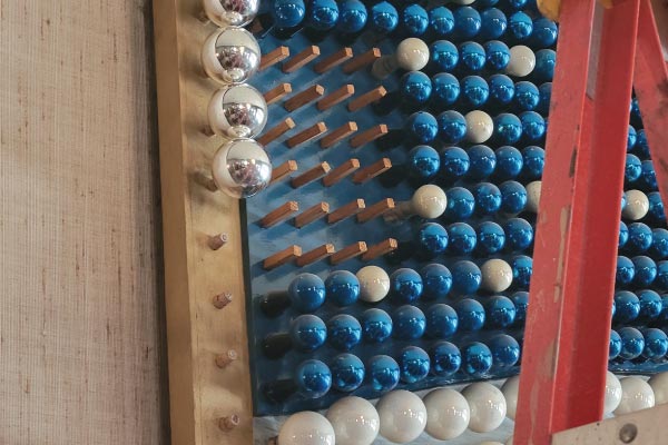 Detail of wooden pegs that hold the glass balls of the American flag at the Penn Wells Hotel